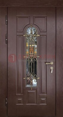 Темная железная дверь со стеклом и ковкой для частного дома ДСК-156 в Химках